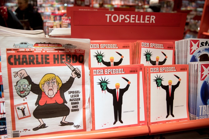 Charlie Hebdo изобразил президента Франции в образе щенка, кусающего Путина