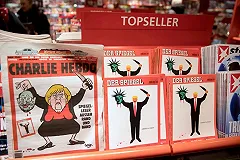 Charlie Hebdo изобразил президента Франции в образе щенка, кусающего Путина